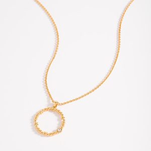 Collar en baño de oro con piedra en tono cristal